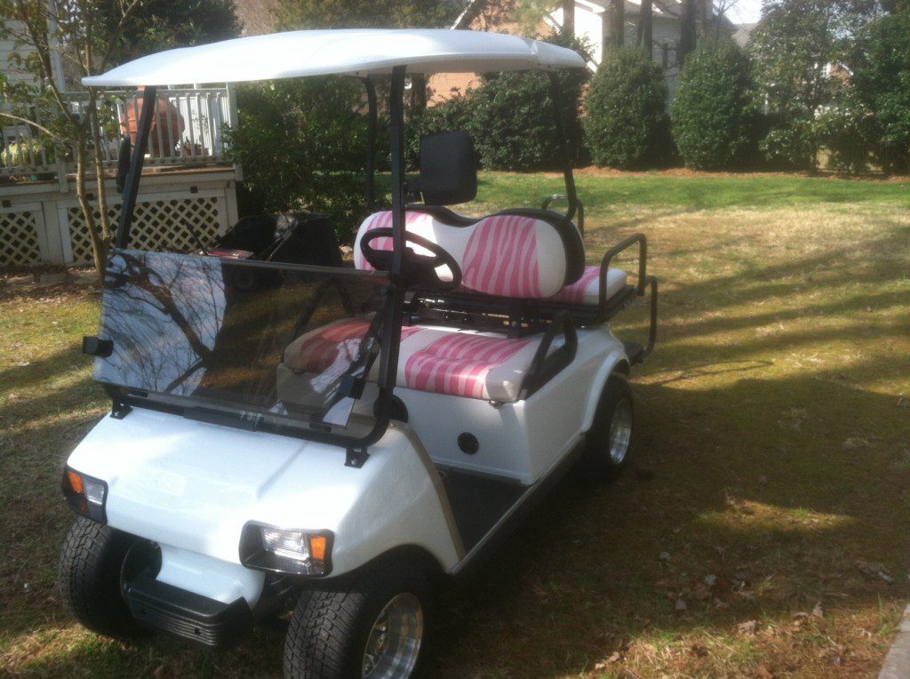 White Golf Cart with Pink Seats