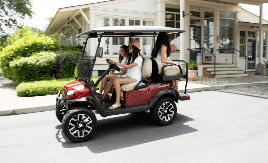 people riding in golf cart